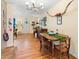Dining area with hardwood floors and a charming dining table set for a cozy meal at 514 Land O Lakes Ct, Deland, FL 32724