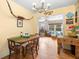 Dining room featuring hardwood floors and an adjacent seating area at 514 Land O Lakes Ct, Deland, FL 32724