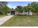 Charming single-story home with a well-maintained lawn and mature palm trees at 514 Land O Lakes Ct, Deland, FL 32724