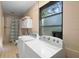 Well-lit laundry room with tiled floors, window, and washer and dryer at 514 Land O Lakes Ct, Deland, FL 32724