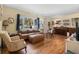 Open living area with hardwood floors, comfortable seating, and natural light at 514 Land O Lakes Ct, Deland, FL 32724