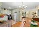 Open concept living and kitchen area with hardwood floors and lots of natural light at 514 Land O Lakes Ct, Deland, FL 32724