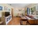 Cozy living room with a comfortable sofa and ample natural light streaming through the windows at 514 Land O Lakes Ct, Deland, FL 32724