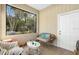 Relaxing screened-in porch with cushioned seating, a coffee table, and views of the landscape at 514 Land O Lakes Ct, Deland, FL 32724