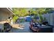 Cozy backyard featuring a wooden picnic table and a variety of potted plants and garden decor at 520 Dixson St, Orange City, FL 32763