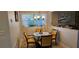 Cozy dining area features neutral walls, chandelier lighting, and window views at 520 Dixson St, Orange City, FL 32763