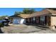 Single-story brick home featuring an attached garage and paved driveway at 520 Dixson St, Orange City, FL 32763