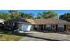 Lovely single story brick home with an attached garage and a double-wide driveway at 520 Dixson St, Orange City, FL 32763