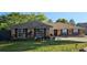 Charming single-story brick home with red shutters and well-manicured landscaping at 520 Dixson St, Orange City, FL 32763