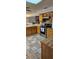 Spacious kitchen featuring wood cabinets, mosaic backsplash and tile flooring at 520 Dixson St, Orange City, FL 32763
