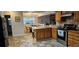 Bright kitchen features wood cabinets, stainless steel appliances, and breakfast table at 520 Dixson St, Orange City, FL 32763