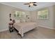 Light and bright bedroom with wood-look floors and a neutral color palette at 525 E Wisconsin Ave, Orange City, FL 32763