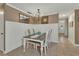 Dining room with wainscoting, chandelier, and a view into the front entry at 525 E Wisconsin Ave, Orange City, FL 32763