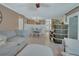 Open-concept living room showing dining area and view of entry and front door at 525 E Wisconsin Ave, Orange City, FL 32763