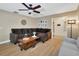 Comfortable living room with a large sectional sofa, stylish decor, and ample natural light at 525 E Wisconsin Ave, Orange City, FL 32763