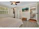Bright main bedroom offering a view of the walk-in closet and ensuite bathroom at 525 E Wisconsin Ave, Orange City, FL 32763