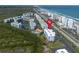 Aerial shot of condos with beach access, a pool, and lush foliage at 5300 S Atlantic Ave # 17-303, New Smyrna Beach, FL 32169