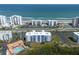 An aerial shot of condos with beach access, a pool, and a tennis court at 5300 S Atlantic Ave # 17-303, New Smyrna Beach, FL 32169