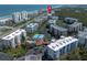 Aerial view of oceanfront condos offering community pool, tennis courts, and beach access at 5300 S Atlantic Ave # 17-303, New Smyrna Beach, FL 32169