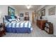 Bright bedroom with beautiful flooring and nautical decor throughout the living space at 5300 S Atlantic Ave # 17-303, New Smyrna Beach, FL 32169