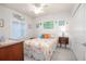 Cozy bedroom with pastel seashell bedding, seaside decor and natural light at 5300 S Atlantic Ave # 17-303, New Smyrna Beach, FL 32169