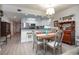 Dining area flows from kitchen, with seating for four and an adjacent breakfast bar at 5300 S Atlantic Ave # 17-303, New Smyrna Beach, FL 32169