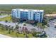 Exterior of a bright 6 story condo building with ample parking and ocean view at 5300 S Atlantic Ave # 17-303, New Smyrna Beach, FL 32169
