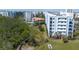 Exterior view of condo building with balconies, pool, and boardwalk at 5300 S Atlantic Ave # 17-303, New Smyrna Beach, FL 32169