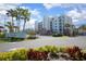 Beautiful condominium exterior with palm trees and manicured landscaping at Ocean Walk in New Smyrna Beach, Florida at 5300 S Atlantic Ave # 17-303, New Smyrna Beach, FL 32169