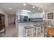 Bright eat-in kitchen with peninsula, breakfast bar, and stainless steel appliances at 5300 S Atlantic Ave # 17-303, New Smyrna Beach, FL 32169