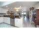 Open kitchen overlooking living area, complete with stainless steel dishwasher at 5300 S Atlantic Ave # 17-303, New Smyrna Beach, FL 32169