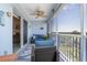 Relaxing screened patio with comfortable seating and a ceiling fan to enjoy the outdoors at 5300 S Atlantic Ave # 17-303, New Smyrna Beach, FL 32169