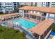 Large community pool with ample lounge chairs and covered seating areas at 5300 S Atlantic Ave # 17-303, New Smyrna Beach, FL 32169