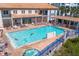 Community pool with plenty of lounge chairs for relaxing and sunbathing at 5300 S Atlantic Ave # 17-303, New Smyrna Beach, FL 32169
