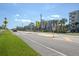 Street view of a crosswalk for a neighborhood community with condos in the background at 5300 S Atlantic Ave # 17-303, New Smyrna Beach, FL 32169