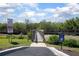 Scenic community walking trail surrounded by lush greenery and picturesque views at 5300 S Atlantic Ave # 17-303, New Smyrna Beach, FL 32169