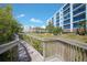 Community walking trail overlooking the condos, showcasing the outdoor amenities at 5300 S Atlantic Ave # 17-303, New Smyrna Beach, FL 32169