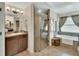 This main bathroom features dual sinks, a shower, and a soaking tub at 53731 Rivertrace Rd, Astor, FL 32102