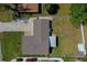 Aerial view of a property with a well-maintained roof, driveway, and green yard at 538 Gertrude Ln, South Daytona, FL 32119