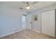 Bedroom with fresh paint, a ceiling fan and ample closet space at 538 Gertrude Ln, South Daytona, FL 32119