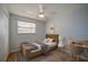 Cozy bedroom boasts a ceiling fan, a window and a neutral color scheme, creating a serene retreat at 538 Gertrude Ln, South Daytona, FL 32119
