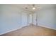 This bedroom features a ceiling fan, large closet, and an adjoining door at 538 Gertrude Ln, South Daytona, FL 32119