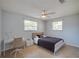 Inviting bedroom with two windows, desk, and closet at 538 Gertrude Ln, South Daytona, FL 32119