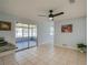 Open dining space with tile flooring, sliding glass doors to the enclosed patio, and light colored walls at 538 Gertrude Ln, South Daytona, FL 32119