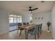 Dining room features a modern light fixture and a glass door leading to an enclosed patio at 538 Gertrude Ln, South Daytona, FL 32119