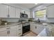 Close up of the kitchen with granite countertops and stainless steel appliances at 538 Gertrude Ln, South Daytona, FL 32119