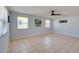 Open-concept room featuring a neutral color palette, tiled flooring, and abundant natural light from the windows at 538 Gertrude Ln, South Daytona, FL 32119