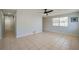 Bright room featuring tiled floors, baseboard trim, neutral colors, and natural light from the window at 538 Gertrude Ln, South Daytona, FL 32119