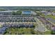 This aerial view captures a well-planned neighborhood with neatly arranged homes and lush green spaces at 544 Red Rose Ln, Sanford, FL 32771