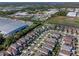Aerial view of a neighborhood with brown roofed homes and a green location pin in the center of the image at 544 Red Rose Ln, Sanford, FL 32771
